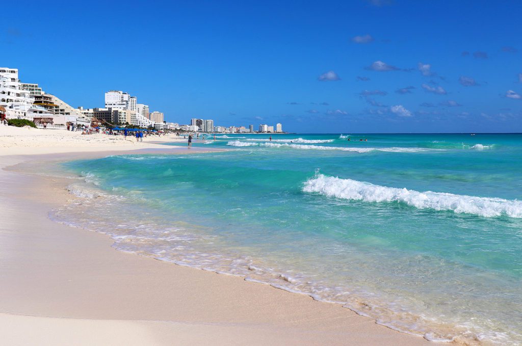 The gorgeous clear, turquoise waters and white sands of Cancun beach.