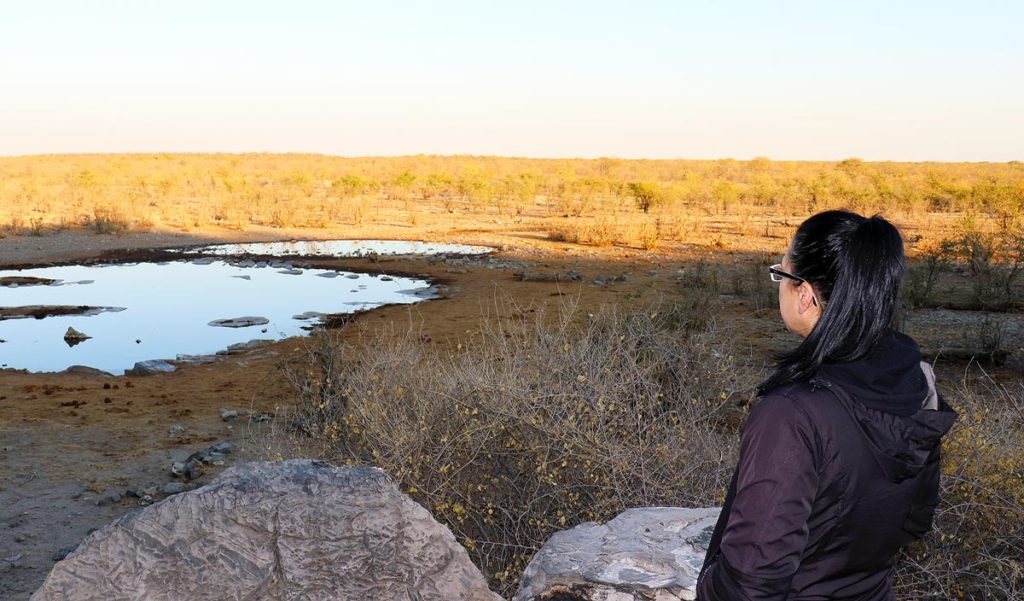 Robyn overlooking a watering hole in Etosha National Park in Namibia. This image represents her trying to find the strength to continue fighting.