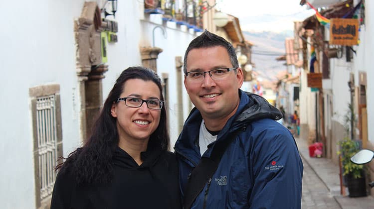 Robyn and Gavin standing on a narrow street in San Blas in Cusco, Peru.