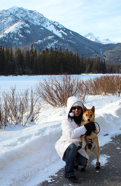 Robyn and her dog posing in front of Cascade Mountain in the Rocky Mountains. Despite the snow, she is blessed to be there!
