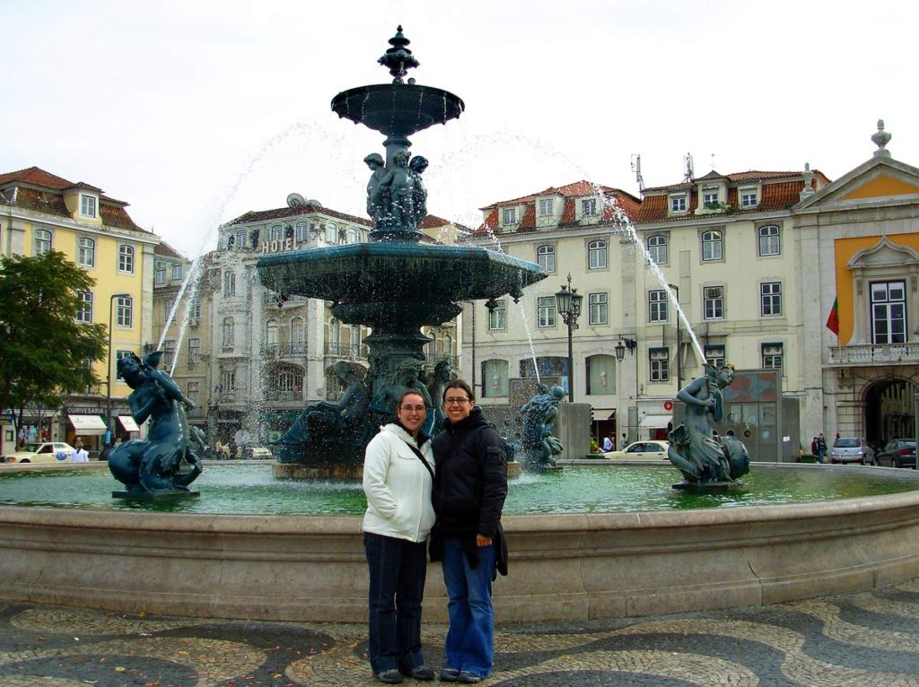 My sister and I standing in front of a beautiful fountain in Lisbon, Portugal. We were following our dream of travel to backpack Western Europe.