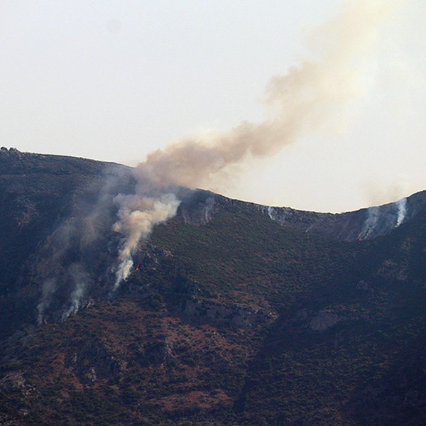 As we drove back to Athens, the heat was so intense that it ignited fires atop the mountains.