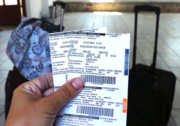 Holding our two ferry tickets to Sifnos in front of our luggage. Robyn's panic attack caused us to miss our original ferry time.