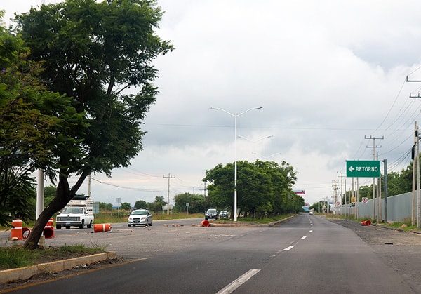 U-turns on the highway or road is very common, instead of a left turn. Sometimes there is a sign indicating you can do this, and sometimes there is not. 