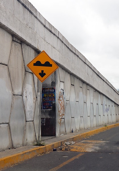 A sign indicating a speed bump on a secondary road in Mexico. One of the most important tips for driving in Mexico is to watch out for speed bumps, and pot holes. They are everywhere!