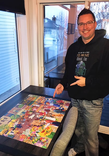 Gavin completing a puzzle. Playing a game or working on a puzzle is an excellent strategy for anxiety.