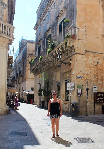 Robyn standing at the corner of two streets in Lecce.