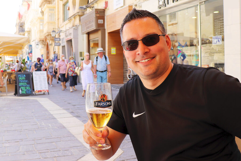 Gavin enjoying a beer on the amin walking street in Valletta.