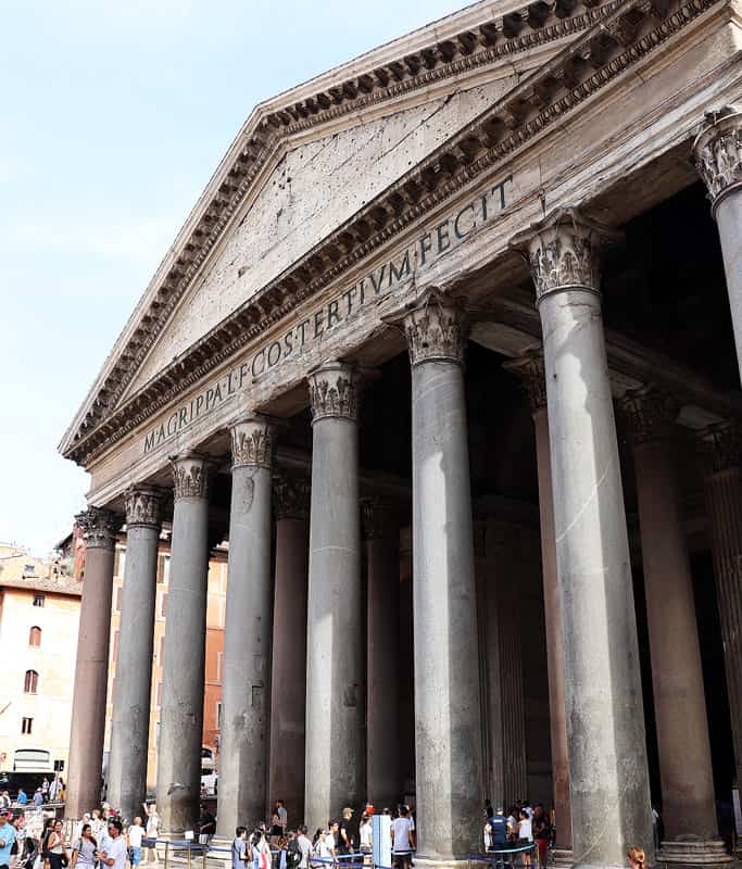 A side view of the Pantheon, with tall columns holding up an ornate triangled facade roof. It's one of the most popular things to do in Rome with limited mobility.