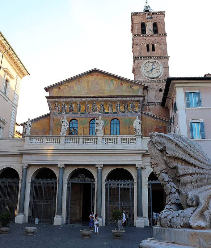 The arched and mosaic facade of Santa Maria Basilica in the famous Trastevere neighborhood of Rome.