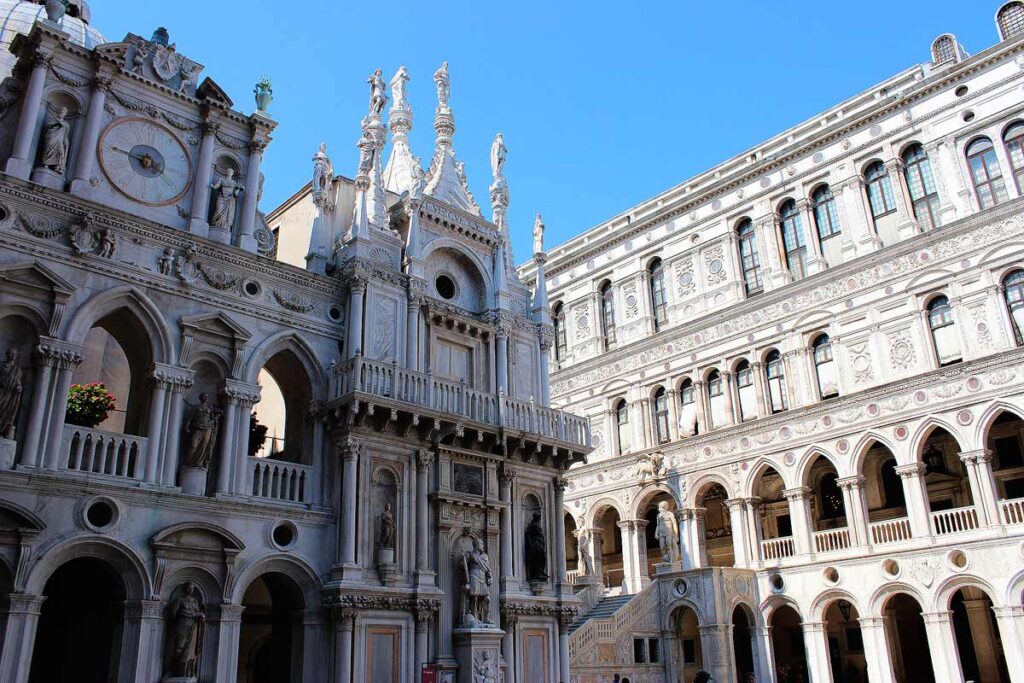 The interior courtyard of Doge Palace with a stunning facade, archways and ornate stone details, making it one of the top Venice attractions for those with limited mobility.