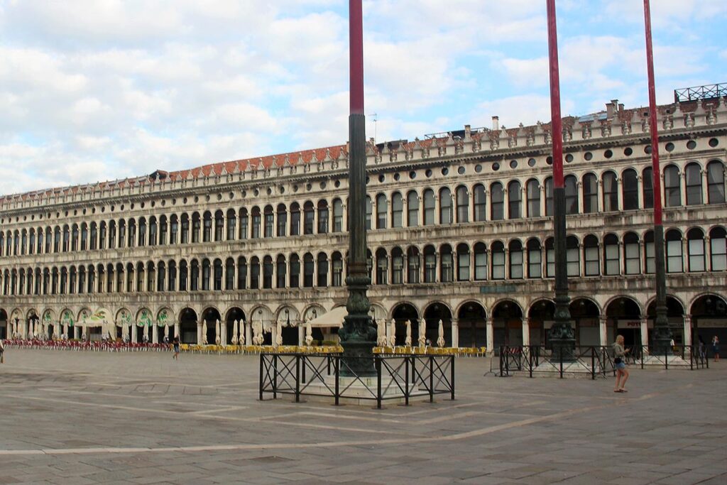An empty, but grand, St. Mark's Square in the early morning, a great choice on a wheelchair accessible day trip to Venice.